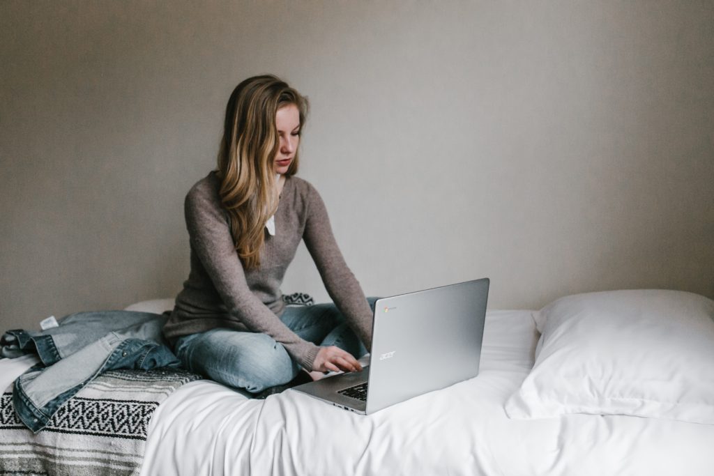 a woman using a laptop